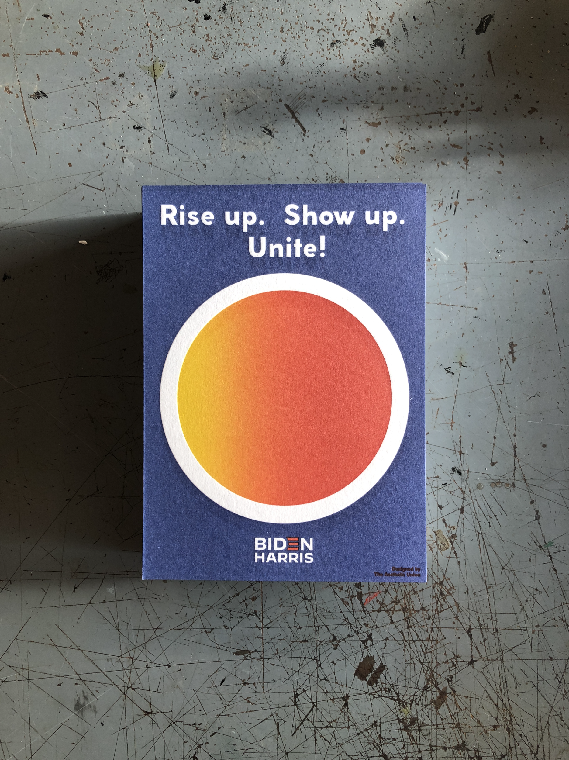 Lettering art of the phrase 'Rise up. Show up. Unite!' by Aesthetic Union